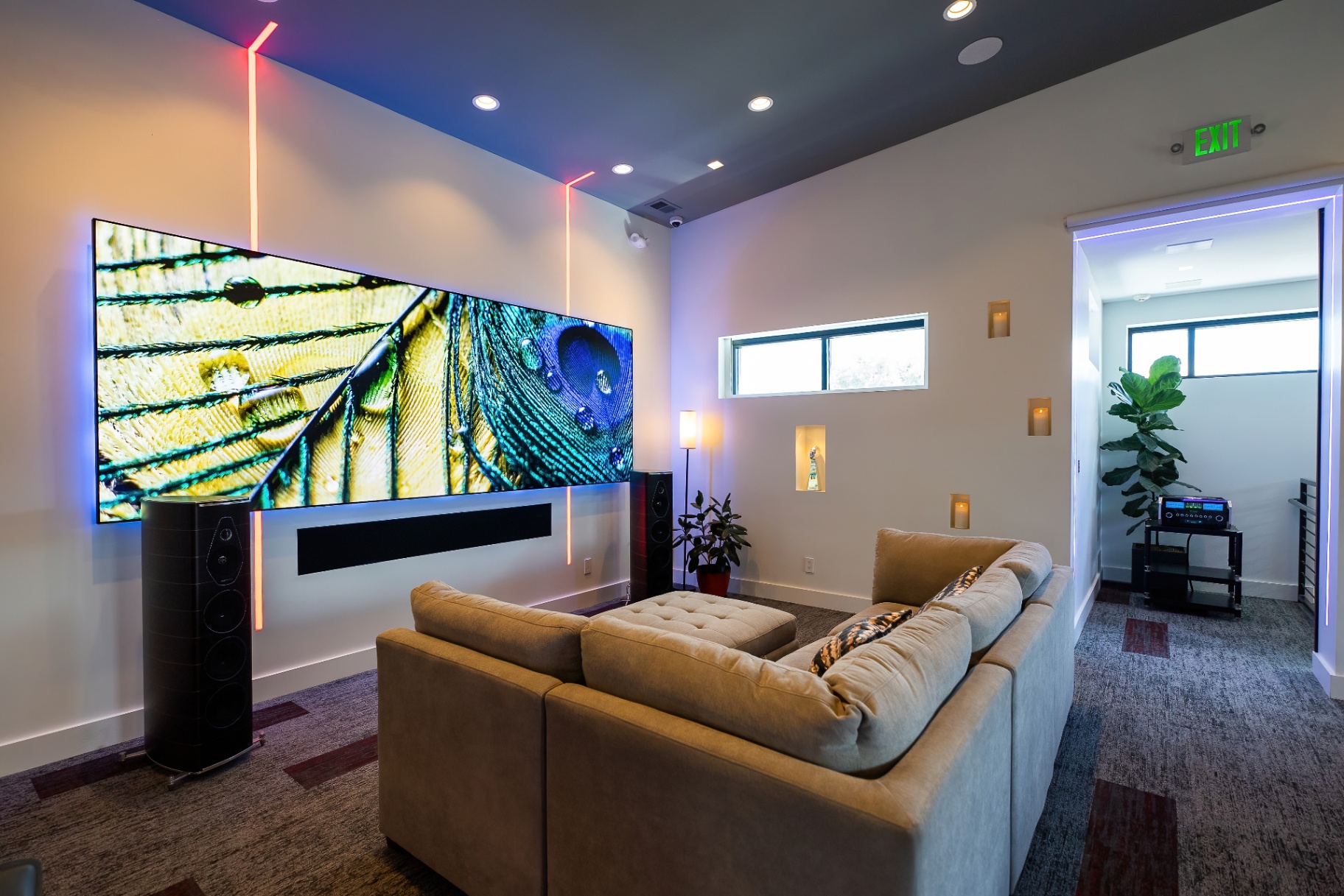 Modern Precision Media media lounge with large screen and ambient lighting