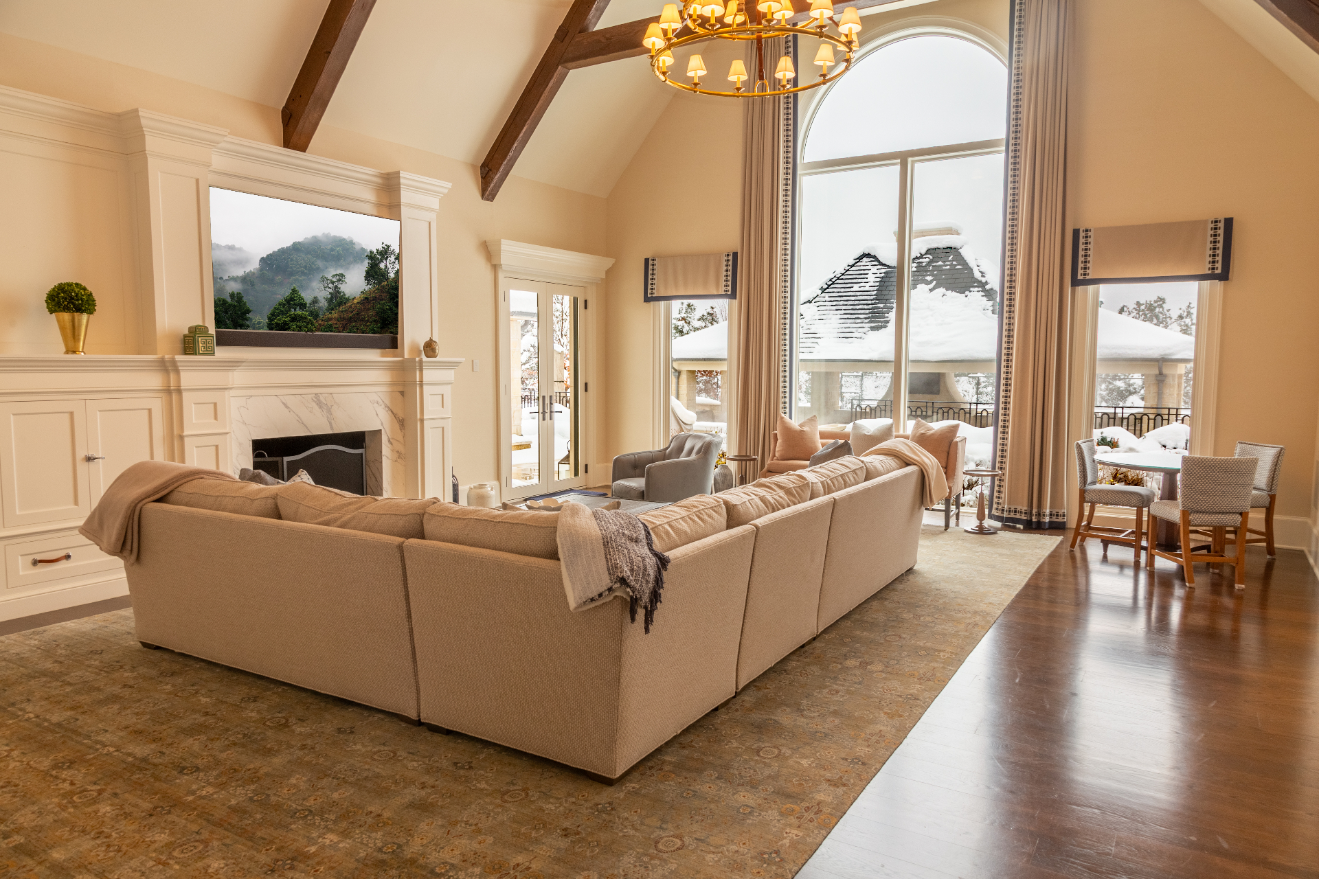 Luxury living room with enormous motorized shades and integrated AV