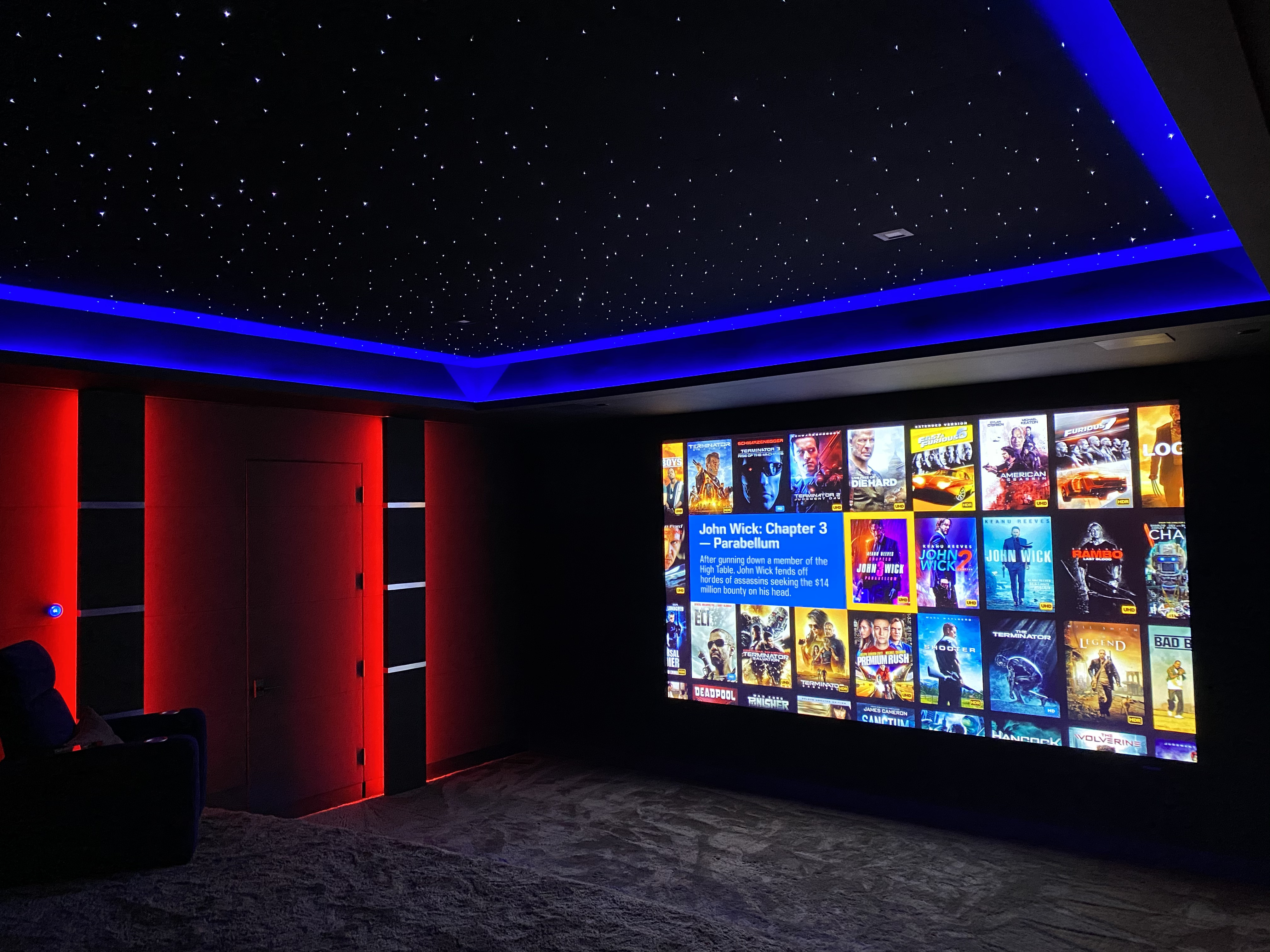 Modern home theater with ambient color lighting and star ceiling
