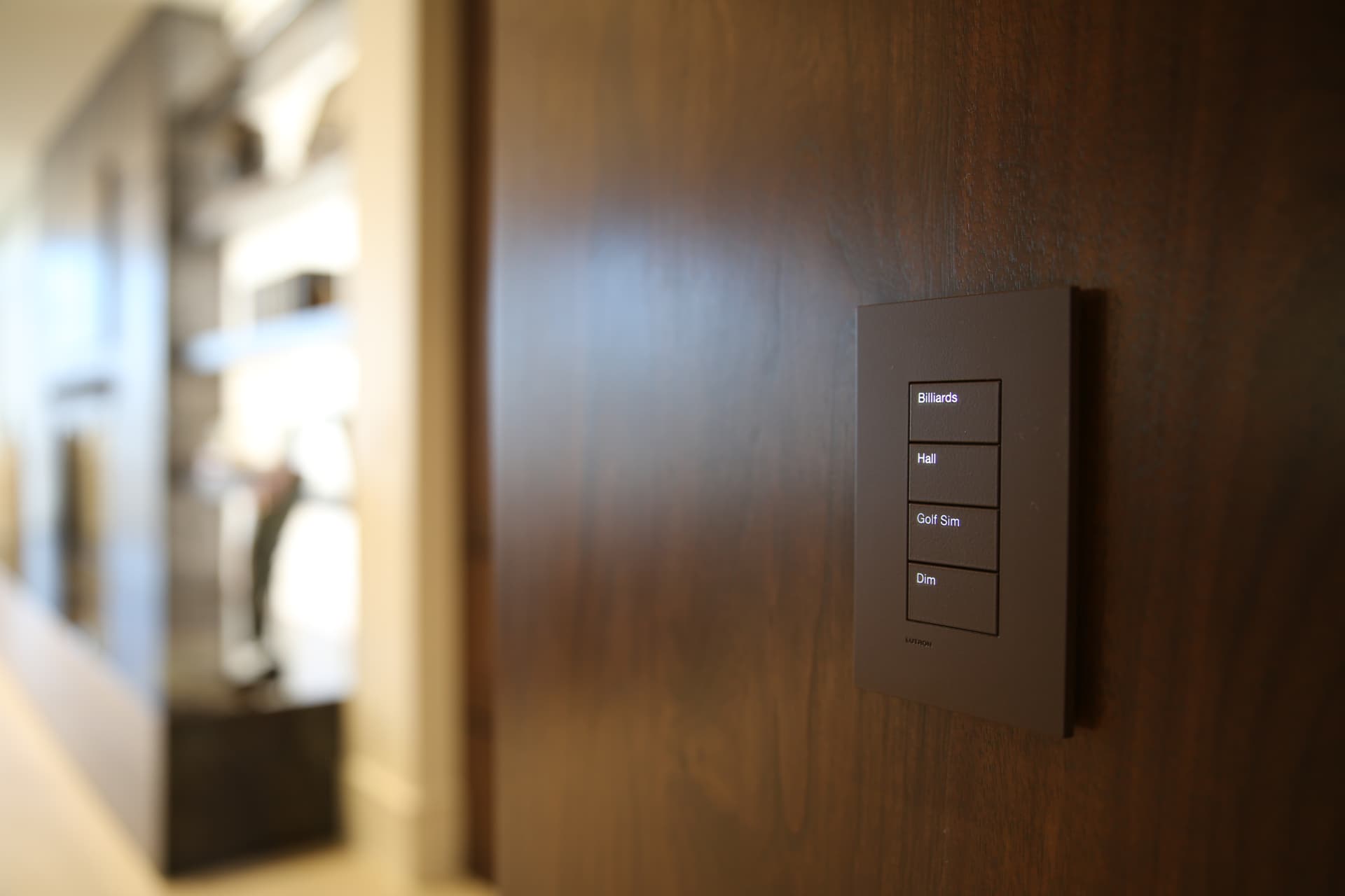 Engraved keypad with scene labels in walnut millwork
