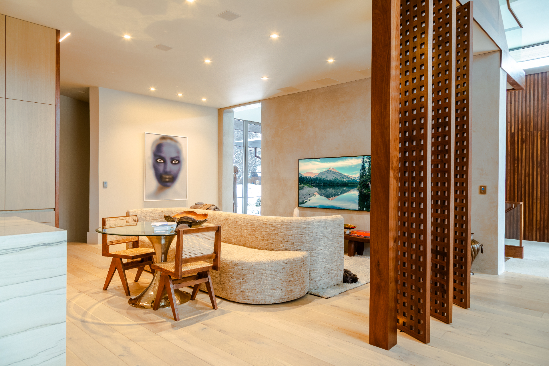 Modern great room with concealed audio and a mounted display